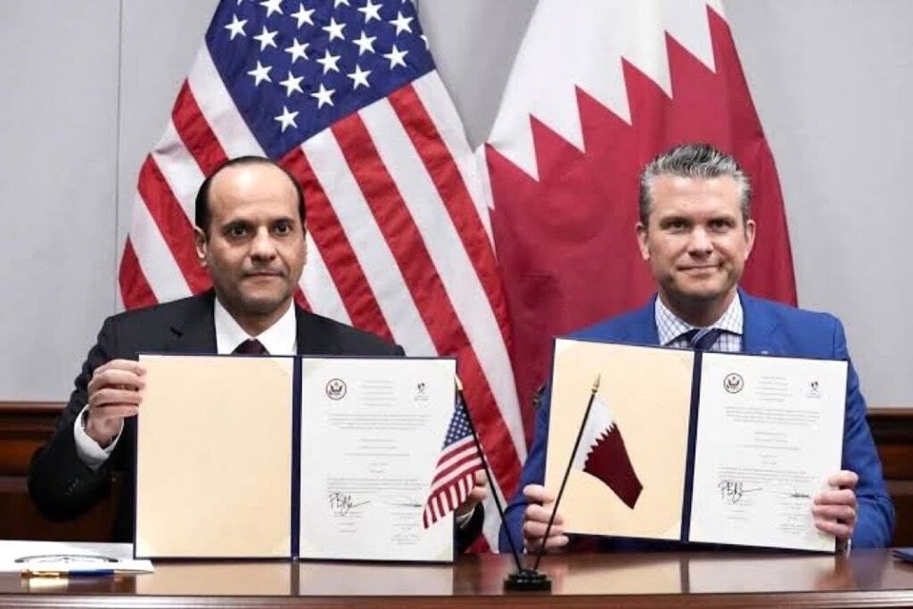 U.S. Defense Secretary Pete Hegseth and Qatar’s Deputy Prime Minister and Minister of Defense Sheikh Saoud bin Abdulrahman al-Thani present a signed agreement as they meet at the Pentagon in Washington, D.C., U.S., October 10, 2025.